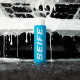 Foam Cloud car wash soap bottle beside thick white foam sheeting off a black car